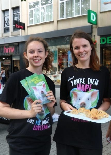 Activists holding sausage rolls