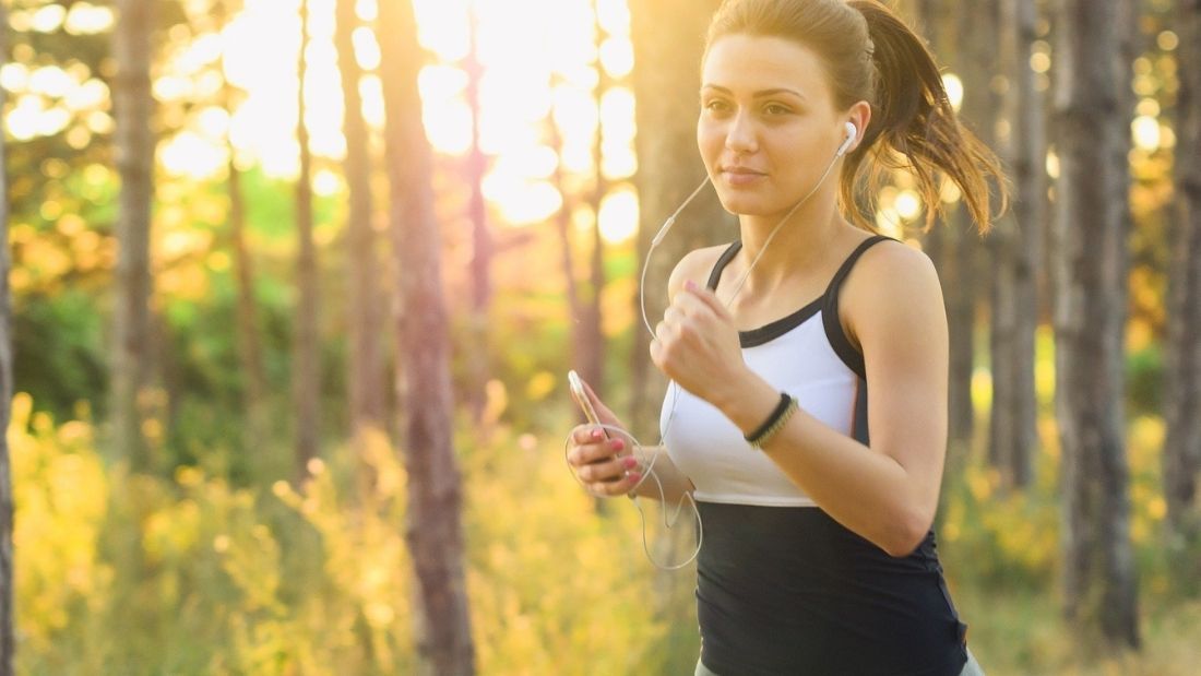 A woman running in the woods