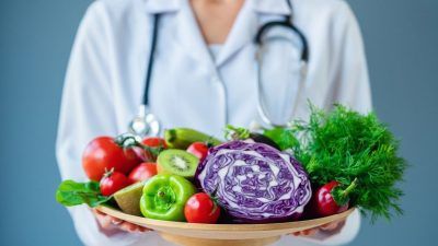 Doctor with fruit and vega