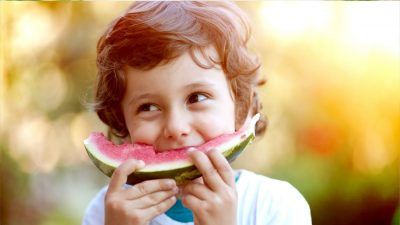 boy eating melon