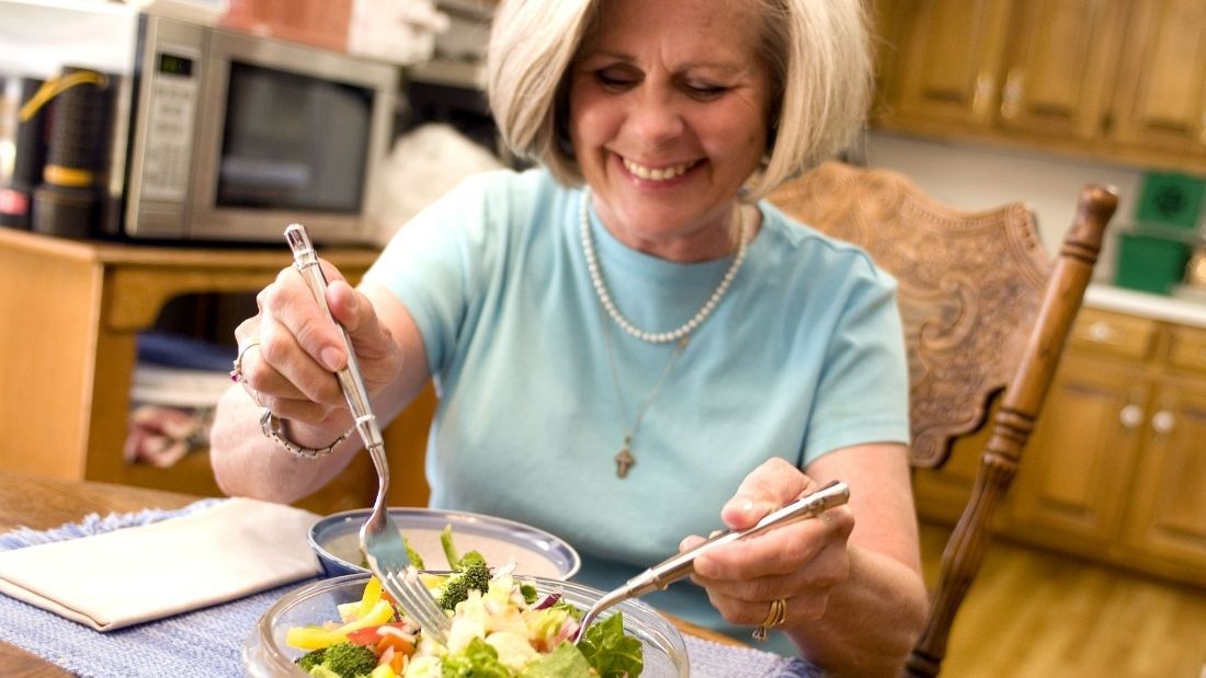 woman eating salad