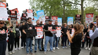 Activists hold placards around Matt Pritchard at our Muller Launch event