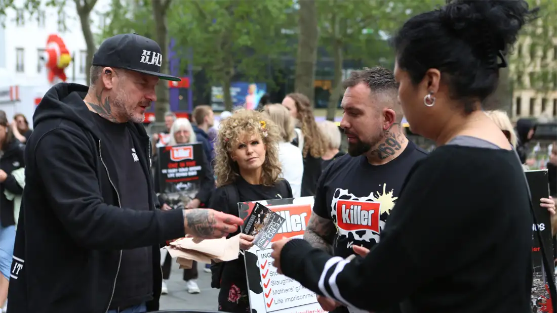 Matt Pritchard handing out yoghurts and having a conversation with the public