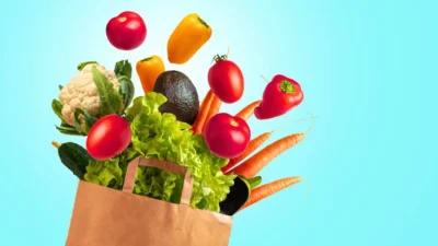 Vegetables flying out of a bag